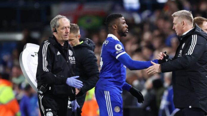 LEEDS, ENGLAND – APRIL 25: Kelechi Iheanacho of Leicester City shakes hands with Dean Smith, Manager of Leicester City after being substituted off after receiving medical treatment during the Premier League match between Leeds United and Leicester City at Elland Road on April 25, 2023 in Leeds, England. (Photo by Alex Livesey/Getty Images)
