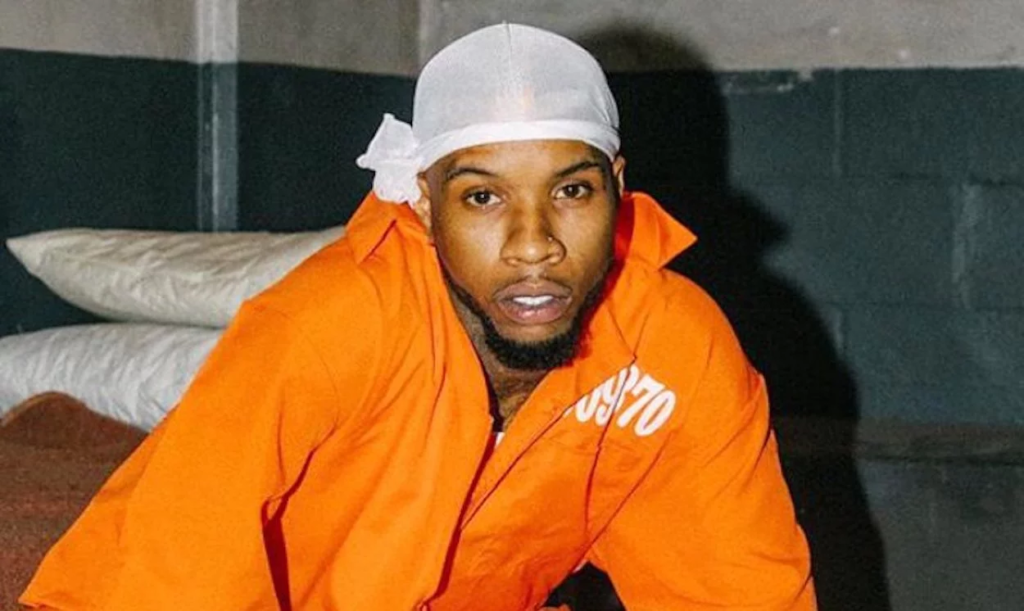 Tory Lanez’s sentencing has been put off to August 7th after the rapper appeared in court on Tuesday following his failed bid to have Judge David Herriford disqualified from the case. Following a rigmarole of legal semantics, it seems that Megan Thee Stallion will finally close the Tory Lanez chapter of her life as the rapper was ordered to return to court on August 7th for sentencing when he appeared in court on Tuesday. Defense attorneys Jose Baez and Matthew Barhoma will need to file their sentencing recommendation by August 1st. Under California minimum sentencing guidelines, Lanez could receive 20 years in jail, but prosecutors have recommended to the judge that Lanez serve 13 years in jail for the three felony charges. That is six years for first-degree assault with a semiautomatic firearm, four years for having a loaded, unregistered firearm in a vehicle, and three years for discharging a firearm with gross negligence. The first two sentences are likely to run concurrently. Tory Lanez grew a beard in jail A drawing from courtroom artist Mona Shafer Edwards shows the “Luv” rapper sporting a new look as he wore his orange prison jumpsuit with a wooden cross on a jute string, and he also sported a full beard and what looks like a black Kufi, a brimless cap worn by Muslims. Meanwhile, the hearing on Tuesday was brief, and it is expected that the legal options available to Tory have now been expended. The rapper previously filed a motion for a new trial claiming that he has ineffective counseling, among other things, and later a motion for disqualification of Judge Herriford claiming that the judge had exercised bias when he denied the motion for a new trial. The judge had denied the defense’s attempt to submit new evidence at the hearing leading to the motion being filed.