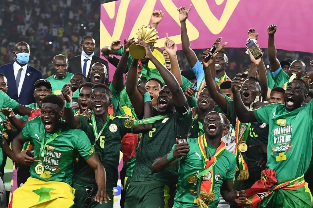 Senegal’s players celebrate with the trophy after winning the Africa Cup of Nations